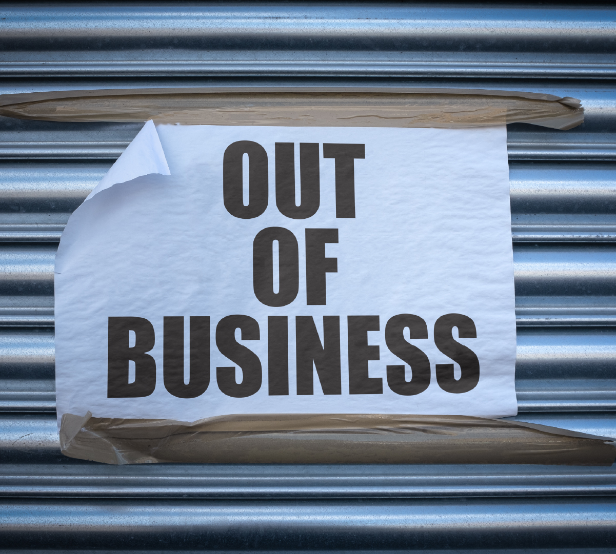 An ‘out of business’ sign on a shutter.